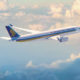 Singapre Airlines aircraft flying through the air.